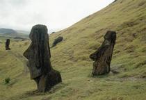 Moai statues, buried up to their necks by soil creep, on the slopes of the volcanic quarry Rano Raraku.