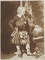 Master James Miller. Full-length standing portrait of the boy, in full Scottish dress, posed martially with his right hand resting on his hip and and his left on a helmet, staring intently off to the