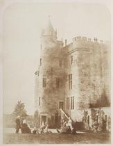 Bonaly. Group of Lord Cockburn's family posed on the lawn of Bonaly Towers. Presumably taken on the same occasion as print 69, this view is primarily an architectural rather than a portrait study, the