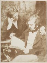 Dr. George Bell, D. O. Hill R.S.A. hree-quarter length study, with Gerorge Bell (d. 1889) seated at table reading, and David Octavius Hill (1802-1870)standing behind him, his left arm round Bell's sho