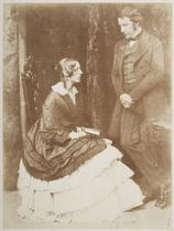 Mr. & Mrs. James Stuart Wortley. Full-length study of Georgiana Elizabeth Stuart-Wortley (c. 1804-1884) seated in right profile, holding a book in her lap, her husband John Stuart Wortley (1801-1855)