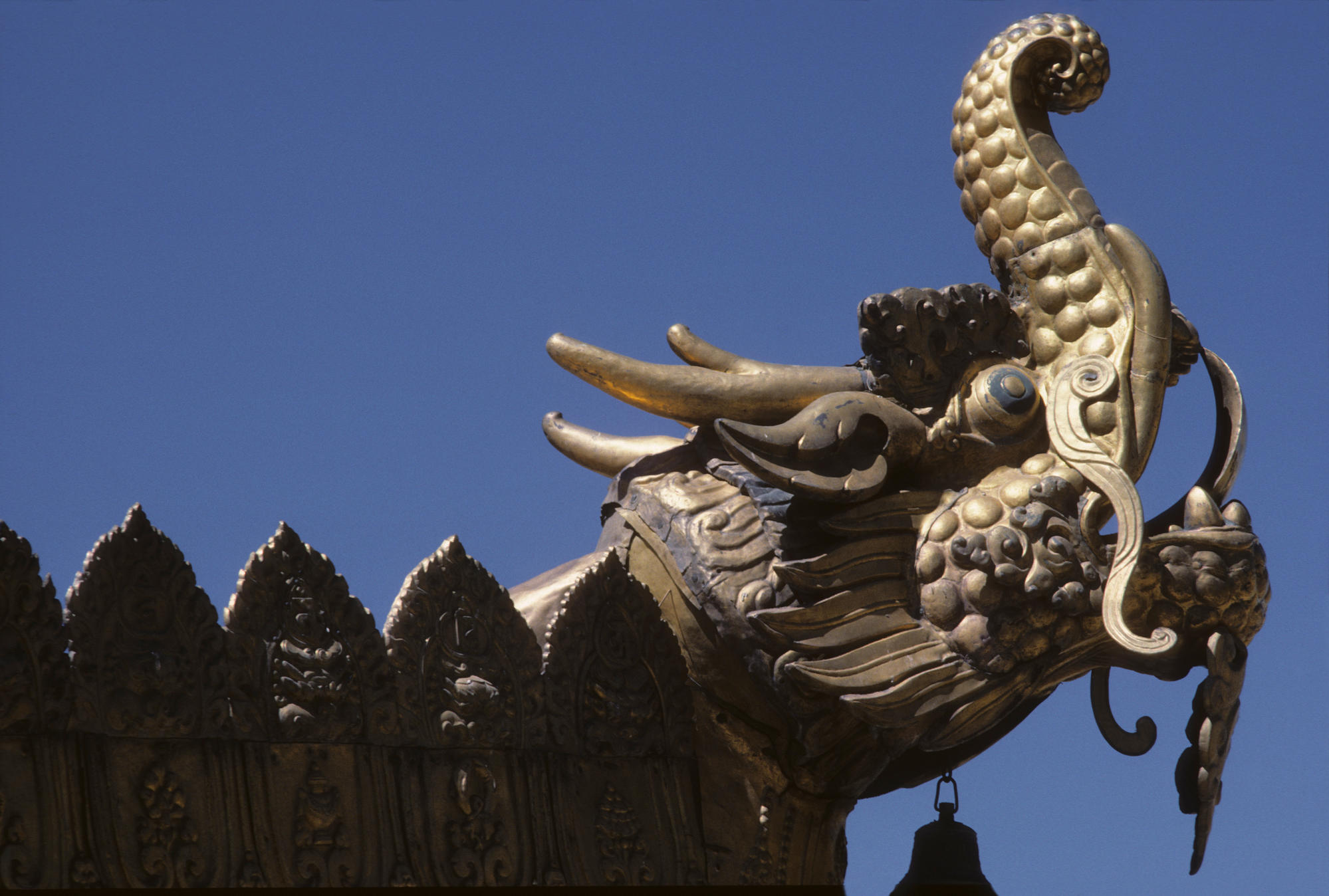 Head of Makara (protector dragon with elephant trunk) on the rooftop of the Jokhang Sanctuary in Lhasa. Copper. 18th CE. 