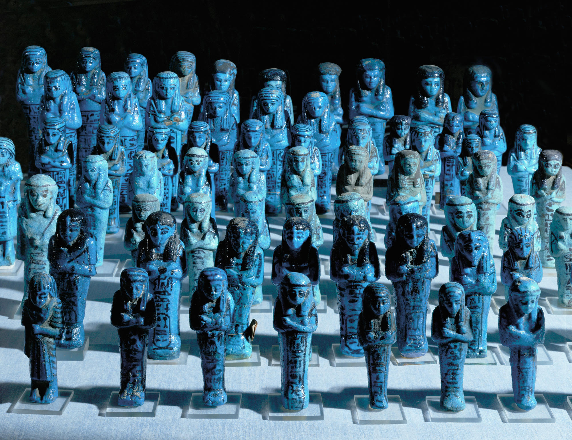 Ushebtis, servants for the deceased in the hereafter. Blue faience. Egypt, Late period (713-332 BCE).